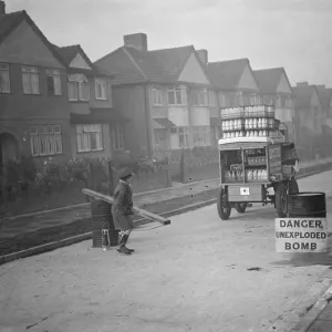 9 November 1940 The milkman is allowed through the barrier to a street in his rounds