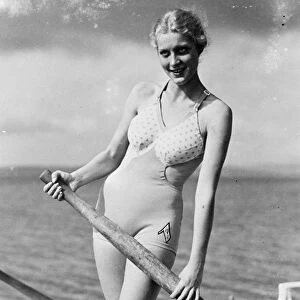 Bathing in brief. Plenty of air and sun for 1936 beach girl. That German woman