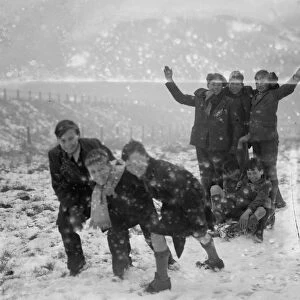 Boys enjoying the snow on Chislehurst Common on their toboggan. 1936