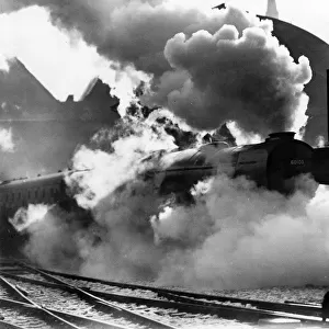 The Flying Scotsman pulls out of Londons Kings Cross station on its last journey