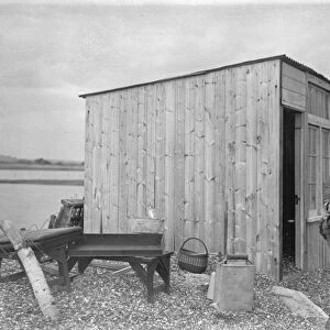 Sea defences broken by flood tide at Winchelsea, bungalows flooded and holidaymakers