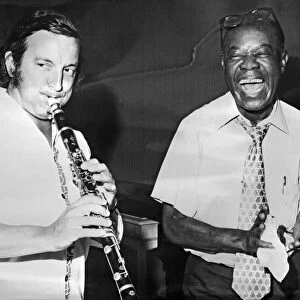 Louis Armstrong playing with French trumpeter Maxime Saury