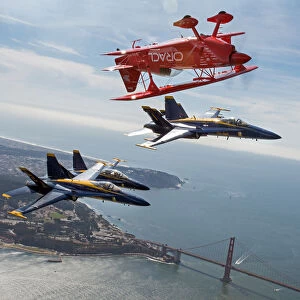 Team Oracle stunt pilot Sean Tucker (above) flies near the Golden Gate Bridge along with three U
