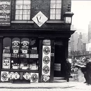 Advertising posters on a shop in North Street, Leeds, c. 1895-1900 (b / w photo)