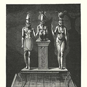 Ancient Egyptian gold sculpture of the gods Isis, Osiris and Horus, from the ancient city of Tanis (engraving)