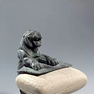 Bronze lion holding a foundation tablet in Hurrite language