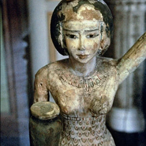 Female bearer of offerings carrying a water vase in her hand and a vessel on her head, Egyptian, Middle Kingdom, c. 1950 BC (stuccoed and painted fig wood) (detail of 93791)
