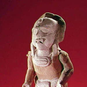 Figure of a masked priest in a ceremony, from the Isle of Jaina (earthenware)