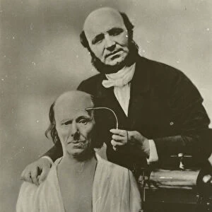French neurologist Duchenne de Boulogne using his electrophysiology apparatus on an old man, 1862 (b / w photo)