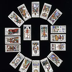 A French stoneware tile panel, decorated with a deck of Marseilles Tarot cards