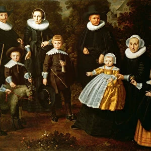 Group portrait of three generations of a family in the grounds of a country house
