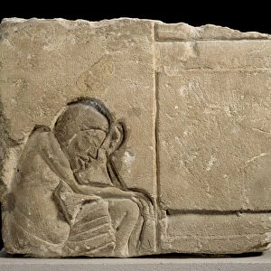 Limestone fragment carved in sunken relief depicting a sleepy servant in the palace