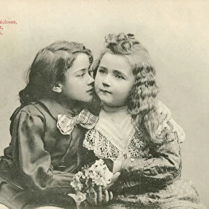Little boy kissing a little girl (b / w photo)