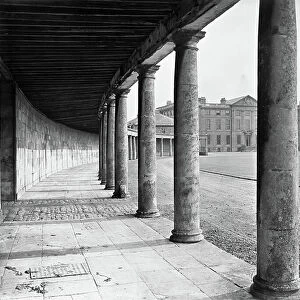 Looking through the colonnade to the entrance facade, Burley-on-the-Hill, Rutland, from The Country Houses of Sir John Vanbrugh by Jeremy Musson, published 2008 (b/w photo)
