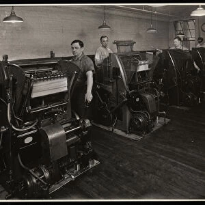 Men working printing presses at Unz & Co. 24 Beaver Street, New York