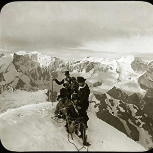 Mountaineering at the end of the 19th or early 20th century: group of mountaineers at the summit of the Wetterhorn (literally "Horn of Time", 3, 692 m), summit of the Wetterhorner massif, Bernese Alps, Canton of Bern, Switzerland - climbing