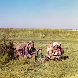 Nomadic Kirghiz: a man, woman and a child in the Golodnaia Steppe, Russian Empire