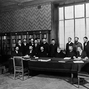 Pasteur and his collaborators in 1894 in the main library of the Pasteur Institute : l-r back row Viala, Reboud, Merieux, Chaillou, Borrel, Marmier, Marie, Veillon, E.Fernbach, A.Fernbach, and l-r front row Calmette, Martin, Roux, Pasteur, Nocard
