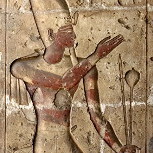 The pharaoh represented with the symbols of his power (low relief)