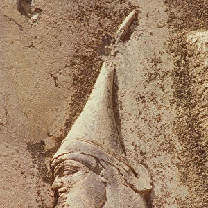 Skunkha, the rebel king, wearing a Scythian hat, detail from Darius Monument