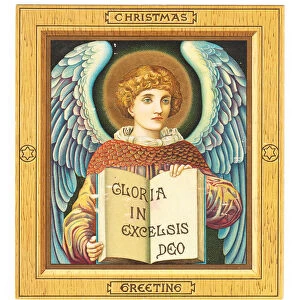 A Victorian Christmas Card of an angel holding a book Gloria in Excelsis Deo
