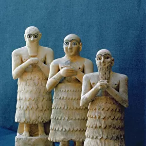 Votive figures unearthed at Nippur, Iraq, c. 2800 BC (alabaster & gold)