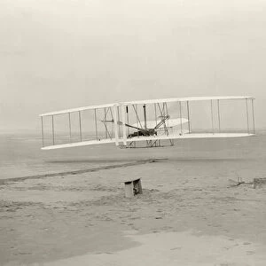The Wright Flyer I makes its first flight of 120 feet in 12 seconds, at Kitty Hawk, North Carolina, 10. 35am, 17 December 1903 (b / w photo)