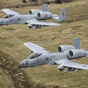 Two A-10 Thunderbolt IIs conduct a training mission over Arkansas