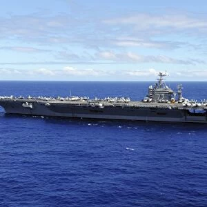 The aircraft carrier USS Abraham Lincoln transits across the Pacific Ocean