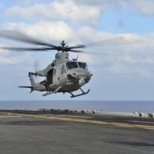 Aviation Boatswains Mate directs a UH-1Y Venom
