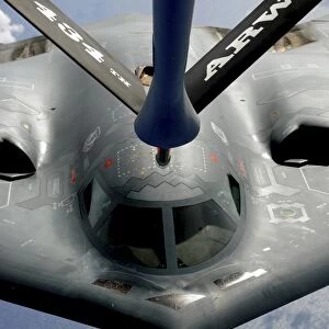 A B-2 Spirit aircraft getting in position to refuel from a KC-135 Stratotanker over