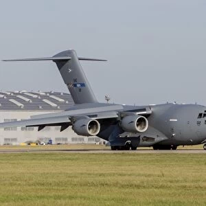 A C-17 Globemaster strategic transport aircraft taxiing on the runway