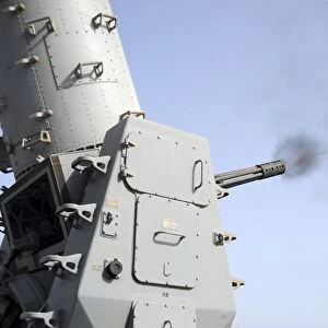 A close-in weapons system fires during an operational test aboard USS Vicksburg