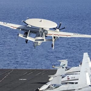 An E-2C Hawkeye launches off the flight deck of USS Nimitz