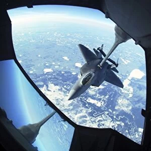 A F-22 Raptor refuels behind a KC-10 Extender