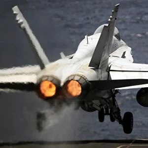 An F / A-18C Hornet launches from USS Abraham Lincoln