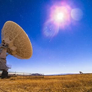 The Very Large Array radio telescope under moonlight in New Mexico