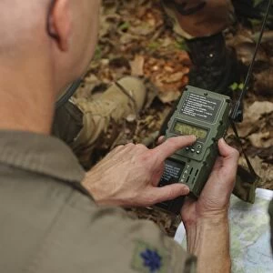 A member of the 130th Airlift Wing practices using a GPS location device