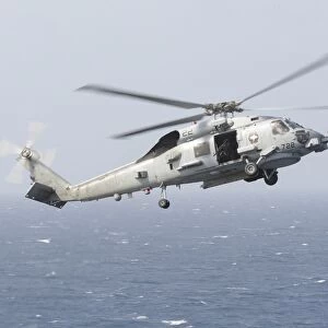 An MH-60R Sea Hawk helicopter prepares to land