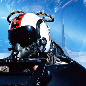 A pilot sitting in the back of a two-seater F-14 Tomcat