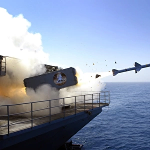A RIM-7 Sea Sparrow missile launches from USS Abraham Lincoln
