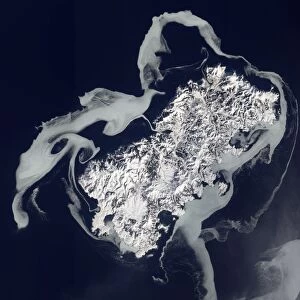 Sea ice surrounds the volcanic island of Shikotan