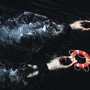 Search and rescue swimmers during a swim call
