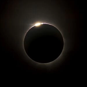 Solar eclipse with prominences and diamond ring effect