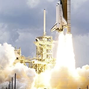 Space Shuttle Atlantis lifts off from its launch pad toward Earth orbit
