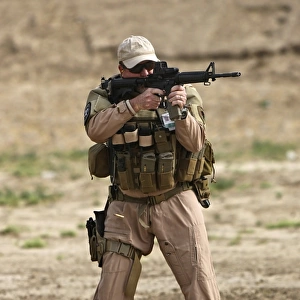 U. S. Contractor firing a M4 Carbine