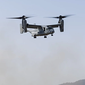 A U. S. Marine Corps V-22 Osprey hovers over Santa Rosa, California