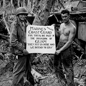 The U. S. Marines salute the U. S. Coast Guard after teh battle for Guam