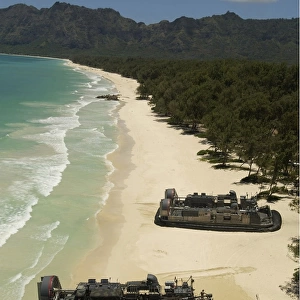 U. S. Navy Landing Craft land on the beach to offload equipment in Oahu, Hawaii