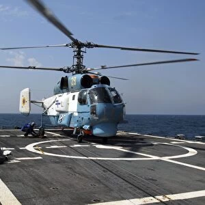 A Ukrainian Navy KA-27 Helix helicopter on the flight deck of USS Taylor